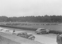 Horse show or horse race in outdoor arena, unknown