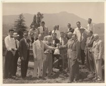 Businessmen at proposed bulding site, date unknown