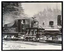 Framed black and white photo of The Iron Steed engine #8