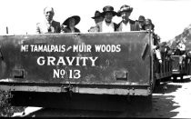 Gravity Car #13 with train, date unknown