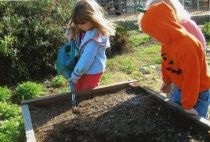 Edna Maguire School 5th grade buddies planting in Children's Garden, 2007