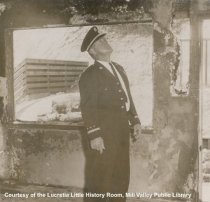 Fire Chief Leslie Armager Inspects Fire Damage, 1957