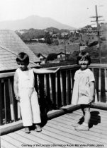 Children on porch at corner of Sydney and Alvarado Streets, 1934