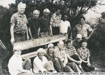 Group posing around the Marin Folk Dancers bench, 1975