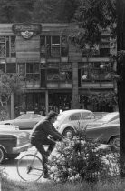 Black and white photograph of bicyclist on Miller Avenue, circa 1967