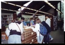 Library patrons at card catalog circa 1993-1994