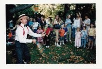 Children and performer at the Big Birthday Party, 1999