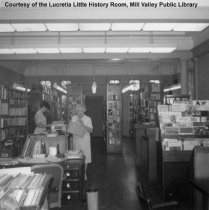 Carnegie Library - Mrs. Delmar Clinton at circulation desk, date unknown