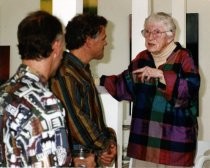 Ann O'Hanlon in discussion with two artists, date unknown