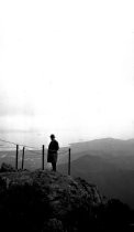 Man at viewpoint East Peak Mt. Tamalpais with Richardson Bay in background