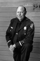 A black and white photo of Mill Valley Police Captain Robert Sisk, 1990