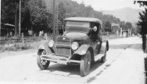 A photograph of a car on Miller Avenue at Park, circa 1920's