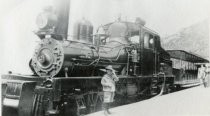 Child posing by the Mount Tamalpais Scenic Railway engine No. 8, date unknown