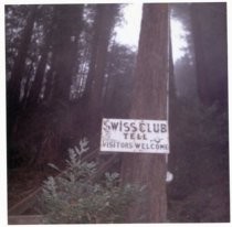 Swiss Club Tell sign on tree, 1962