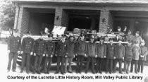 Men in front of fire truck at the Mill Valley fire station, date unknown