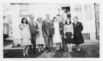 Nine men and women posing outside, 1944