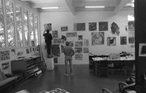 Artists examining work at the O'Hanlon Center for the Arts, circa 1990s