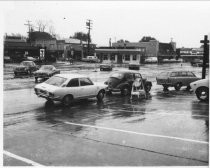 Cars lined up at gas station on Miller Avenue, 1974