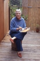 Ann O'Hanlon mixing paint outdoors, 1977