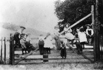 Children playing on the gate of the Blithedale Hotel, late 19th century