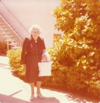 Irene Coffin standing outside a building, 1976