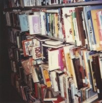 Overcrowded bookshelves, 1984