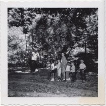 Children waiting to use a tree swing, 1956