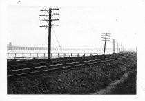 Railroad commuter train line, telephone poles, Richardson Bay Bridge, circa 1930's