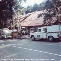 Trucks outside the new library during construction, 1966