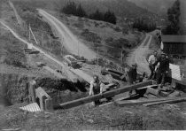 MMWD workers connecting pipe for Belvedere Reservoir, circa 1930