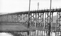 Railroad commuter train line, telephone poles, Blythdale overpass aka Alto Viaduct, circa 1930's