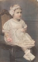 Small girl sitting in chair, unknown