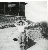 Traveler posing at the West Point Inn, date unknown