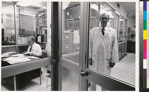 [Male workers behind glass partition, Standard Oil Company of California, Richmond, California.]