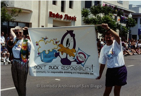 1994 - San Diego LGBT Pride Parade: Contingent - Earl Storm (right) Creator of 'Buckminster Duck' Cartoon, promoting Safer Sex Practices