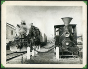 individual Photograph from Sarvis' Alaska Photo Album Depicting Two Steam Locomotives At A Depot