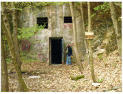 Photograph of An Unidentified Man Next To An Abandoned Building At His POW Camp in Berga