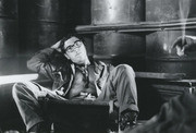 Photograph by Gustafsson of A Fellow Soldier Sitting Next To Giant Drum Containers in A Hammock Which He Found