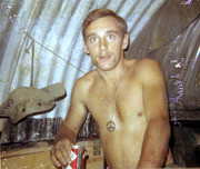 Photograph by Gustafsson of A Fellow Soldier inside A Camp Structure