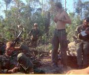 Photograph of Gustafsson and Fellow Soldiers Standing Surrounded by Wilderness