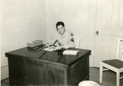 Photograph of Gammey Sitting At Desk in England, 1948