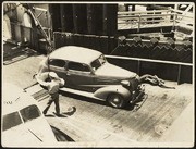 Attendant Signaling Car Onto Ferry