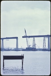 Crane Lowering Section of Bridge Span Between Girders