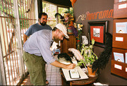 Visitors sign the guestbook at the Velaslavasay Panorama