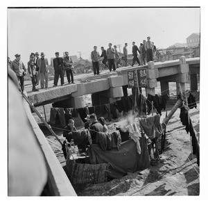 Bleaching and dyeing operation next to a pedestrian bridge, South Korea 1956/1959