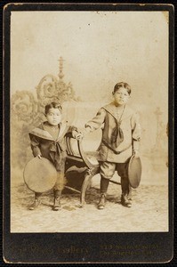 A cabinet card studio portrait of two Latino boys, circa 1894