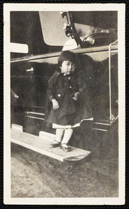 A set of eight snapshots, Japanese Americans posed with automobiles, circa 1910