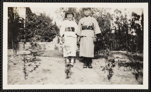 A set of eight snapshots, Japanese American children in traditional attire, circa 1920