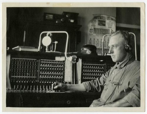 Fire fighter at switchboard, Los Angeles