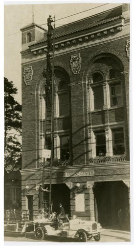 Fire fighters on ladder truck, Engine Co. No. 28, Los Angeles